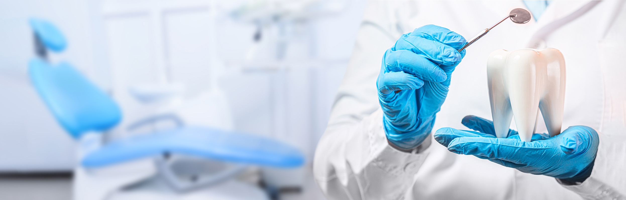 Dental professional checking a patient's teeth